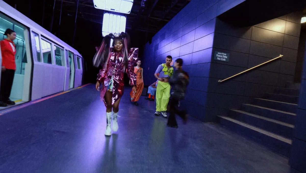 Camera operator filming a parkour athlete on a production set